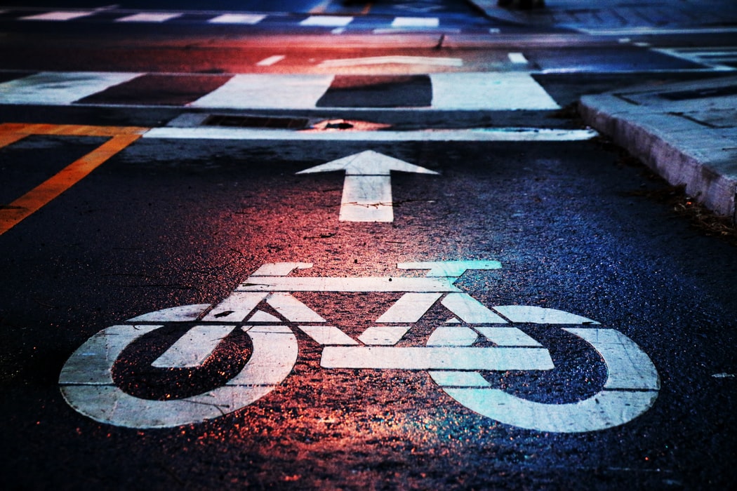 bicycle lane marking on road with an arrow