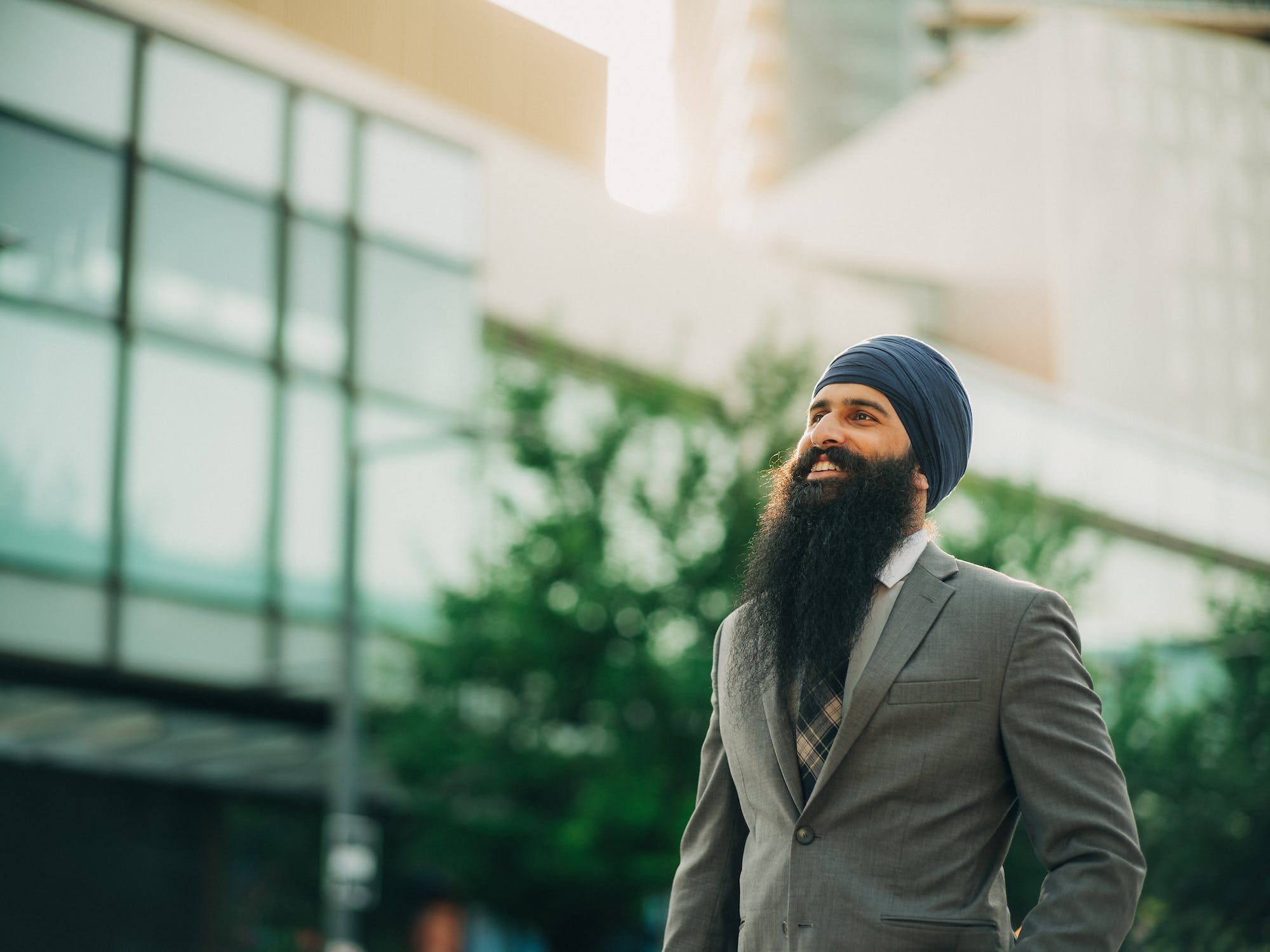 Sikh man in a suit on a crosswalk